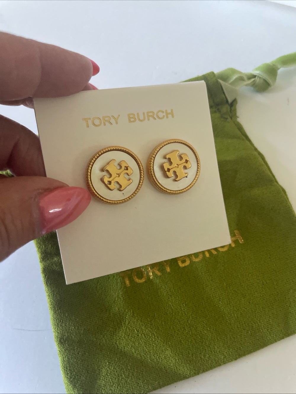 Tory Burch mother of pearl and gold tone earrings